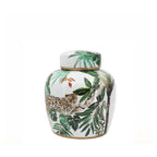 Design Republique Jungle Lidded Jar Multi Coloured featuring a white ceramic jar with green jungle leaf and leopard detailing.