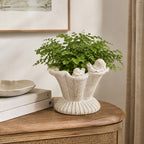 Design Republique Flower Planter Natural styled with a green plant on a wooden sideboard.