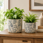Design Republique Renee Planter Set of 2 Green styled on a wooden sideboard with plants.