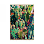 Framed artwork of colorful cacti on a white background