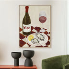 Design Republique Dish Wine Framed Canvas styled on a wall above a console table with black planters and a green chair.