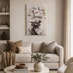 A striking portrait canvas featuring expressive brushstrokes and oversized florals that gracefully veil the subject's eyes creates a bold, contemporary focal point in a warm, neutral living space.