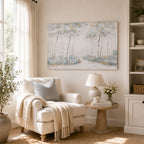 A bright, inviting living space features a serene birch forest canvas above a cosy reading nook, styled with soft neutral furnishings and natural wood accents.