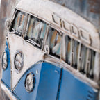 A close-up of a vintage-style blue and white van 3D metal wall art.