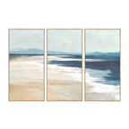 Cove On the Beach Framed 3 Piece in Blue/White, featuring a coordinating coastal landscape triptych in soft blue, white, beige and sandy tones with light wood-look frames.