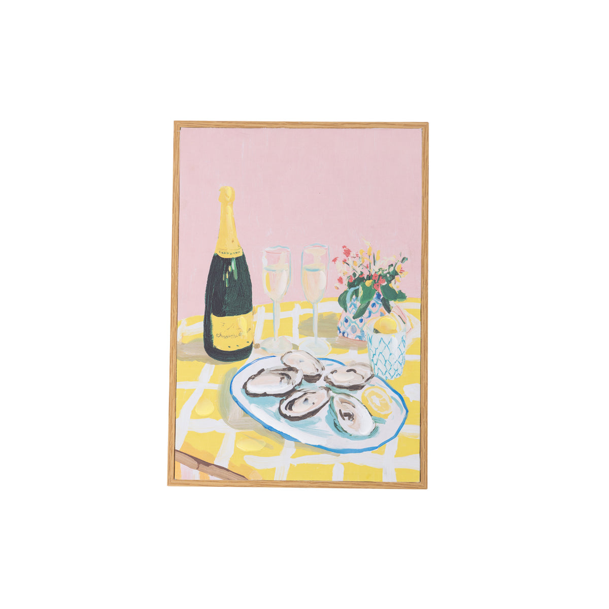 A framed still life painting featuring a bottle of champagne, two glasses, a plate of oysters, and a small flower arrangement on a yellow-and-white checkered table against a pink background, shown on a white backdrop.