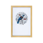 Rectangular wall art with a natural wood-look frame, featuring a vibrant blue and brown Tui perched amongst detailed black and white Harakeke flowers with touches of red, displayed in a circular design on a white background.