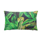 An outdoor breakfast cushion featuring a vibrant green tropical banana leaf pattern on a dark background, shown against a plain white studio backdrop.