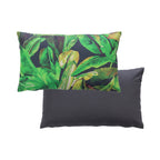 An outdoor breakfast cushion featuring a vibrant green tropical banana leaf pattern on a dark background, with a plain reverse shown against a plain white studio backdrop.