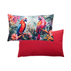 An outdoor breakfast cushion featuring a two parrots with a vibrant tropical pattern on a light background, with a plain red reverse shown against a plain white studio backdrop.