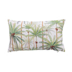 An outdoor cushion featuring a tropical palm tree pattern on a white background, photographed against a solid white studio backdrop.