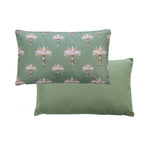 An outdoor breakfast cushion featuring a tropical palm tree pattern on a soft green background, with a plain soft green reverse.