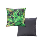 An outdoor cushion white background: with a green tropical banana leaf pattern on a black base, and a reverse solid dark gray.
