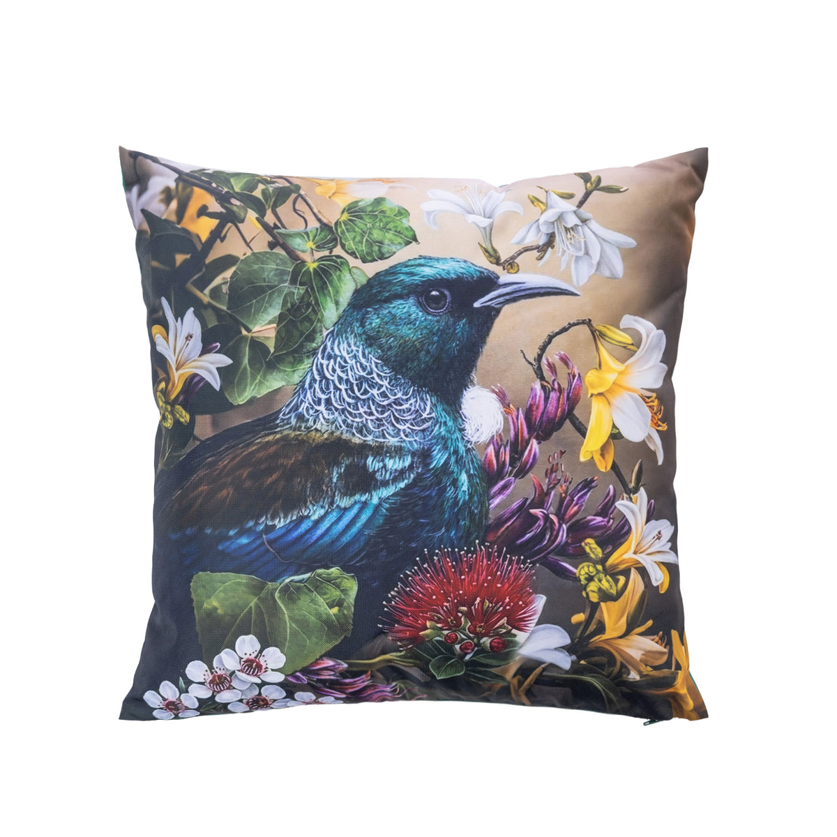 An outdoor cushion featuring a detailed print of a New Zealand tūī bird surrounded by native flowers and foliage, set against a plain white background.