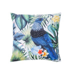 An outdoor cushion featuring a detailed print of a Tui bird perched among tropical foliage & flowers on a white background.