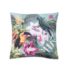 An outdoor cushion featuring a vibrant tropical jungle print with toucans, parrots, palm leaves, and flowers on a  soft green background.
