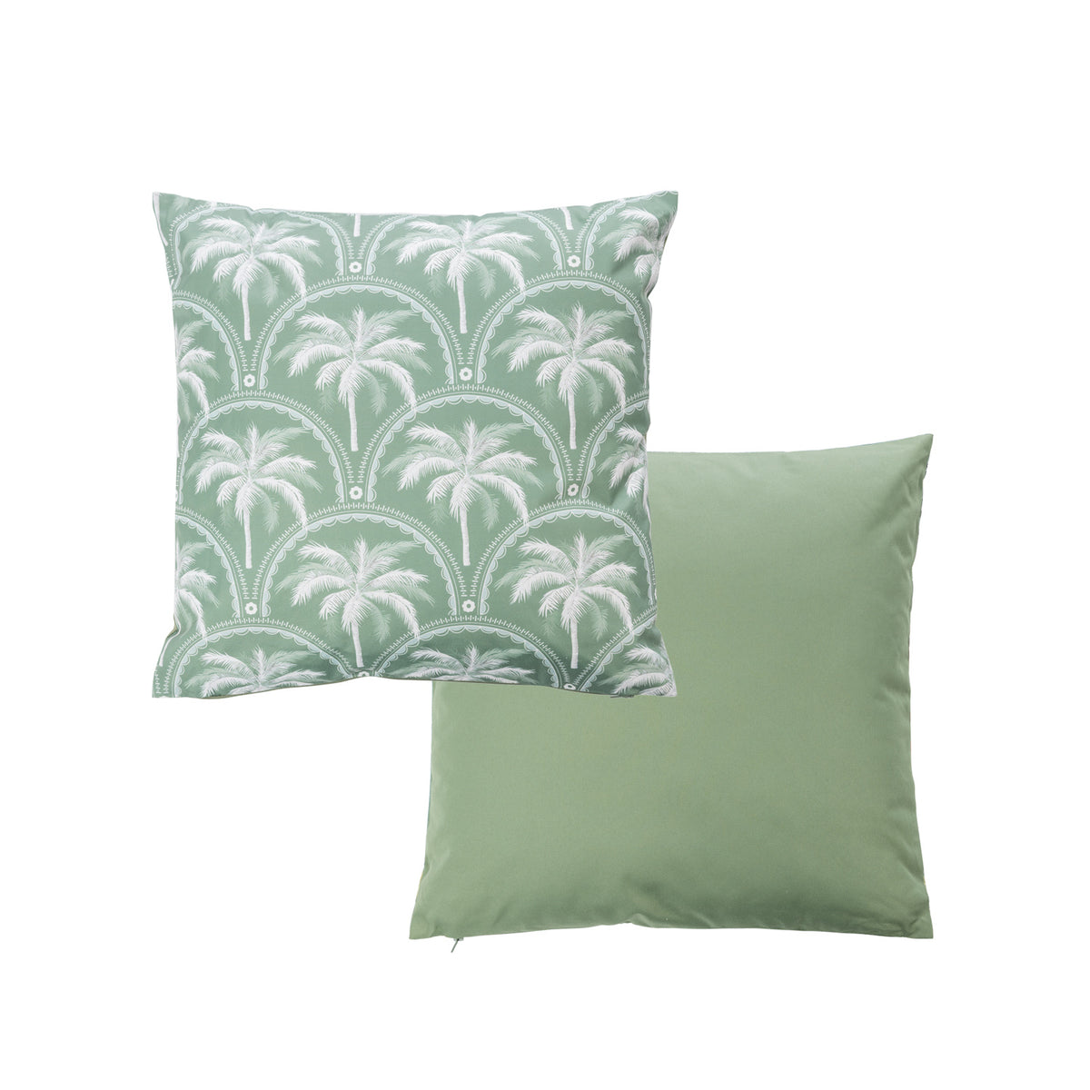 An outdoor cushion features a palm tree pattern in white & green while the reverse is a solid green color.