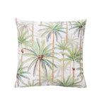 An outdoor cushion featuring a tropical palm tree pattern on a light background, shown against a plain white studio backdrop.