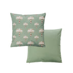 An outdoor cushion featuring  features a green background with a repeating pattern of white palm trees with gold trunks. With a plain green reverse.