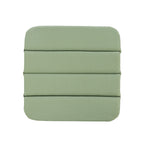 A square green seat pad with rounded corners and horizontal stitched sections, shown against a plain white background.