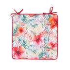 A square chair Pad featuring a vibrant tropical floral and palm leaf print in shades of pink, red, green, and orange on a white background, finished with a red border and two red ties at the top corners.