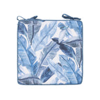 A outdoor chair pad featuring a blue and white tropical banana leaf pattern, shown against a plain white background.