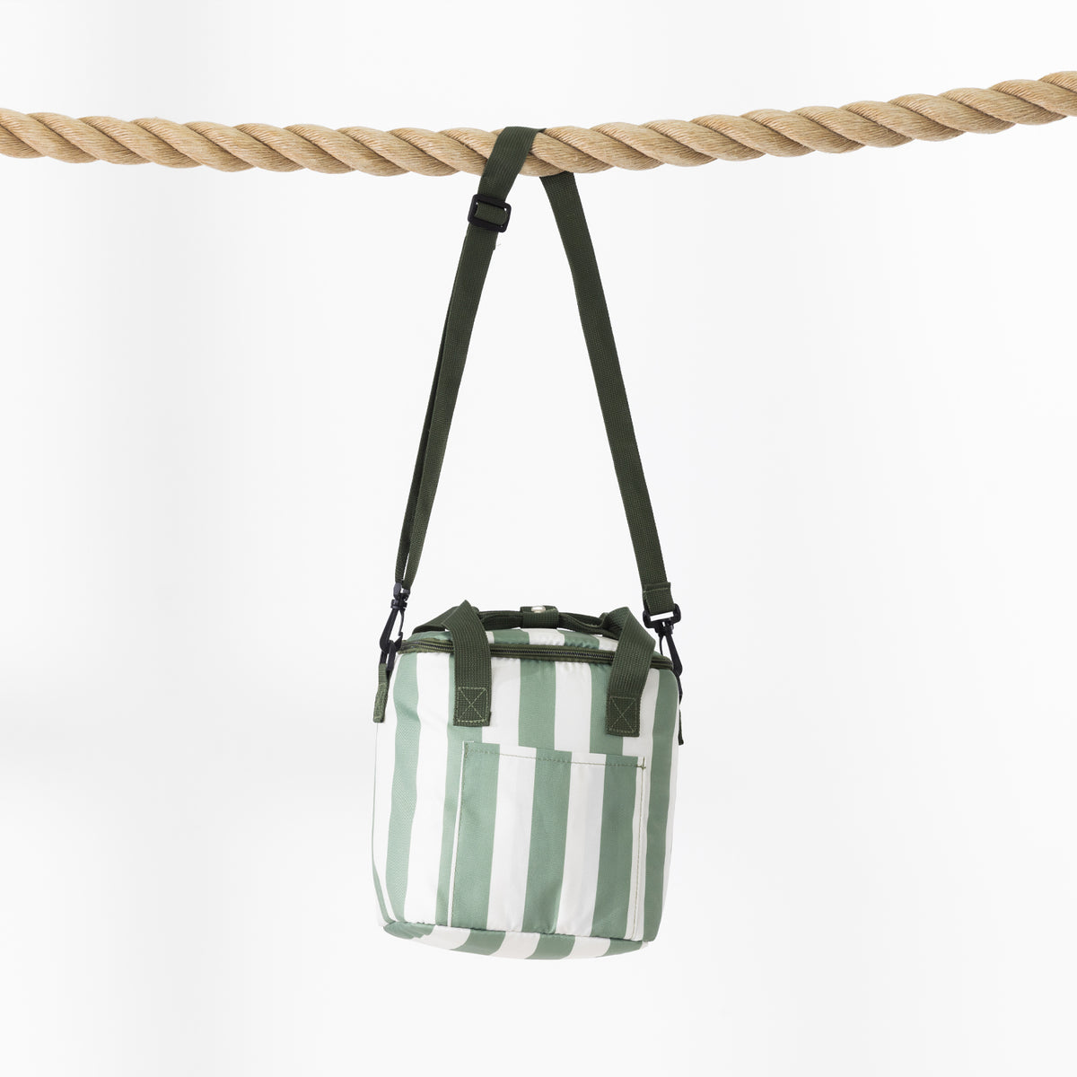 A small striped cooler bag with a dark green strap hangs from a thick rope against a plain white background.