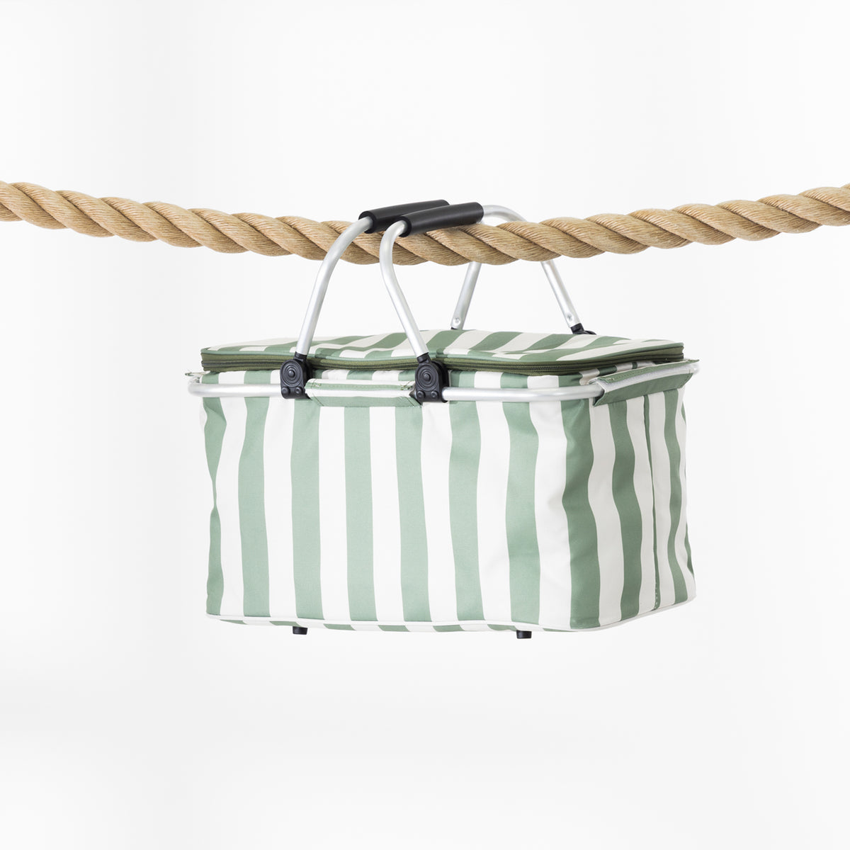 A rectangular folding cooler basket with a stripe print, suspended by a black handle from a thick natural rope against a clean white background.