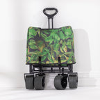 olded Havana green leaf-print beach trolley shown upright with four wheels and pull handle.