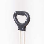 Close-up of the trolley’s black ergonomic pull handle and cream handle frame.