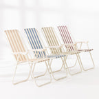 Four striped folding beach chairs in Green Stripe, Blue Stripe, Natural Stripe and Mocha arranged together on a white studio background.