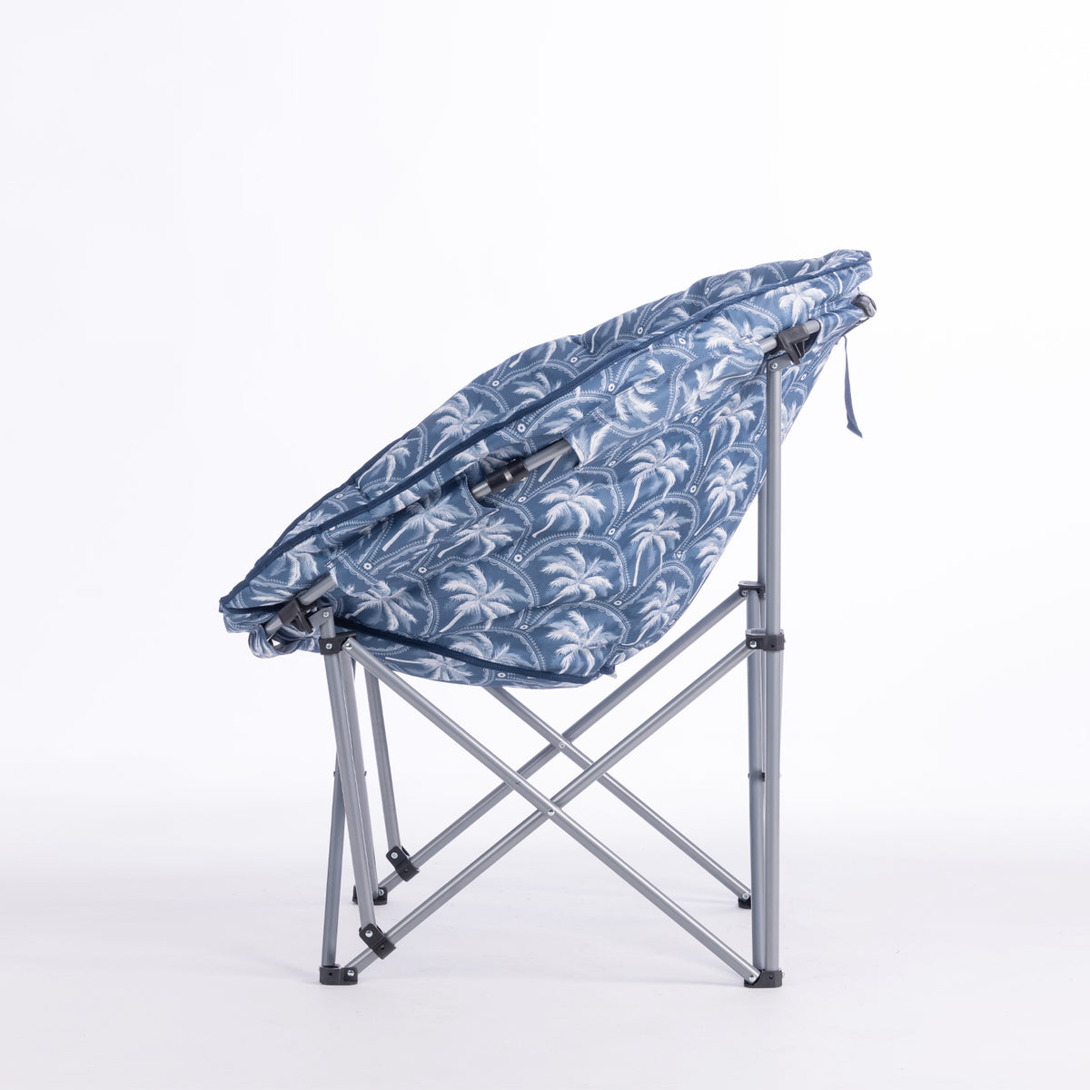 A folding moon chair with a blue and white palm tree patterned fabric seat cushion and a silver metal frame, shown on a plain white background.