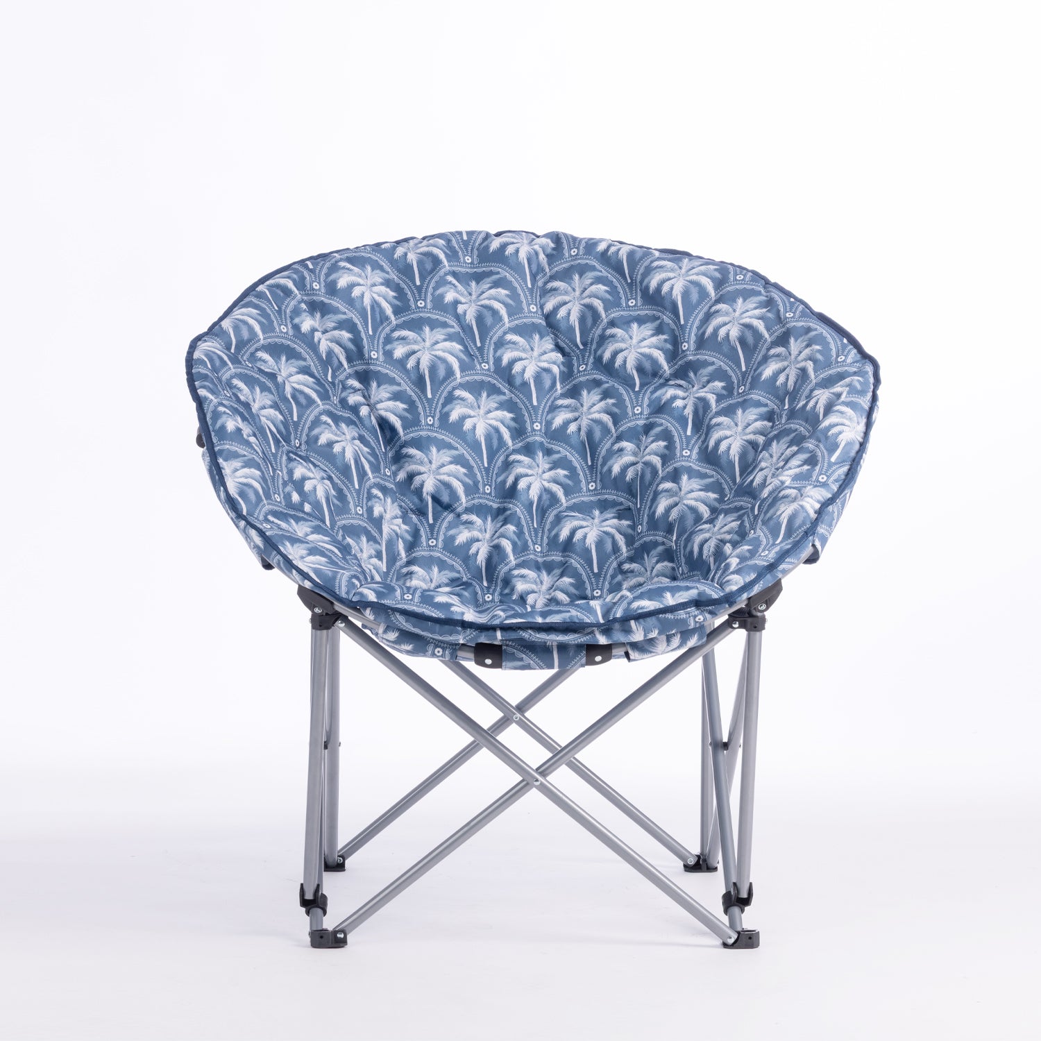 A folding moon chair with a blue and white palm tree patterned fabric seat cushion and a silver metal frame, shown on a plain white background.