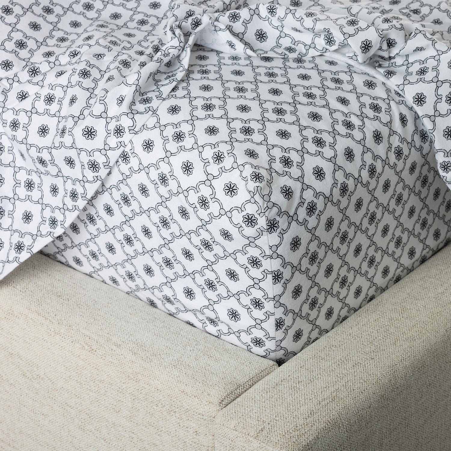 Close-up of patterned fabric on a beige surface