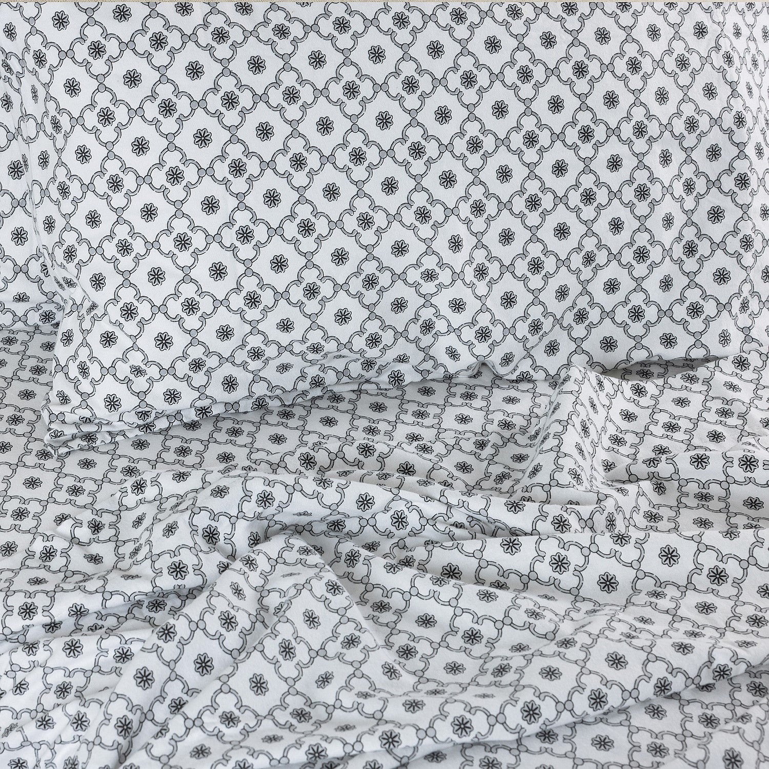 Floral patterned fabric with a lattice design on a white background