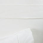 Close-up of a white sheet with a blurred background