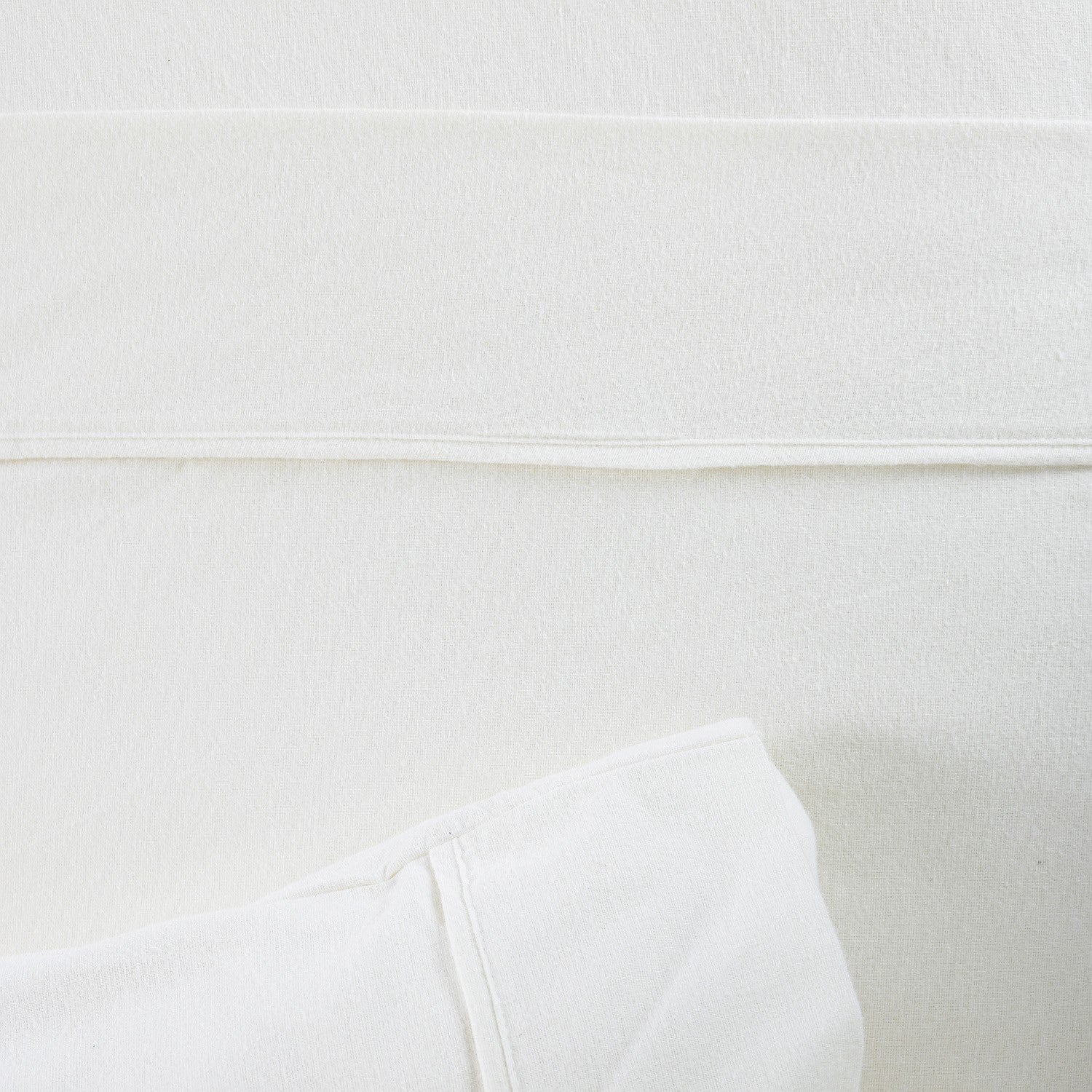 Close-up of a white sheet with a blurred background
