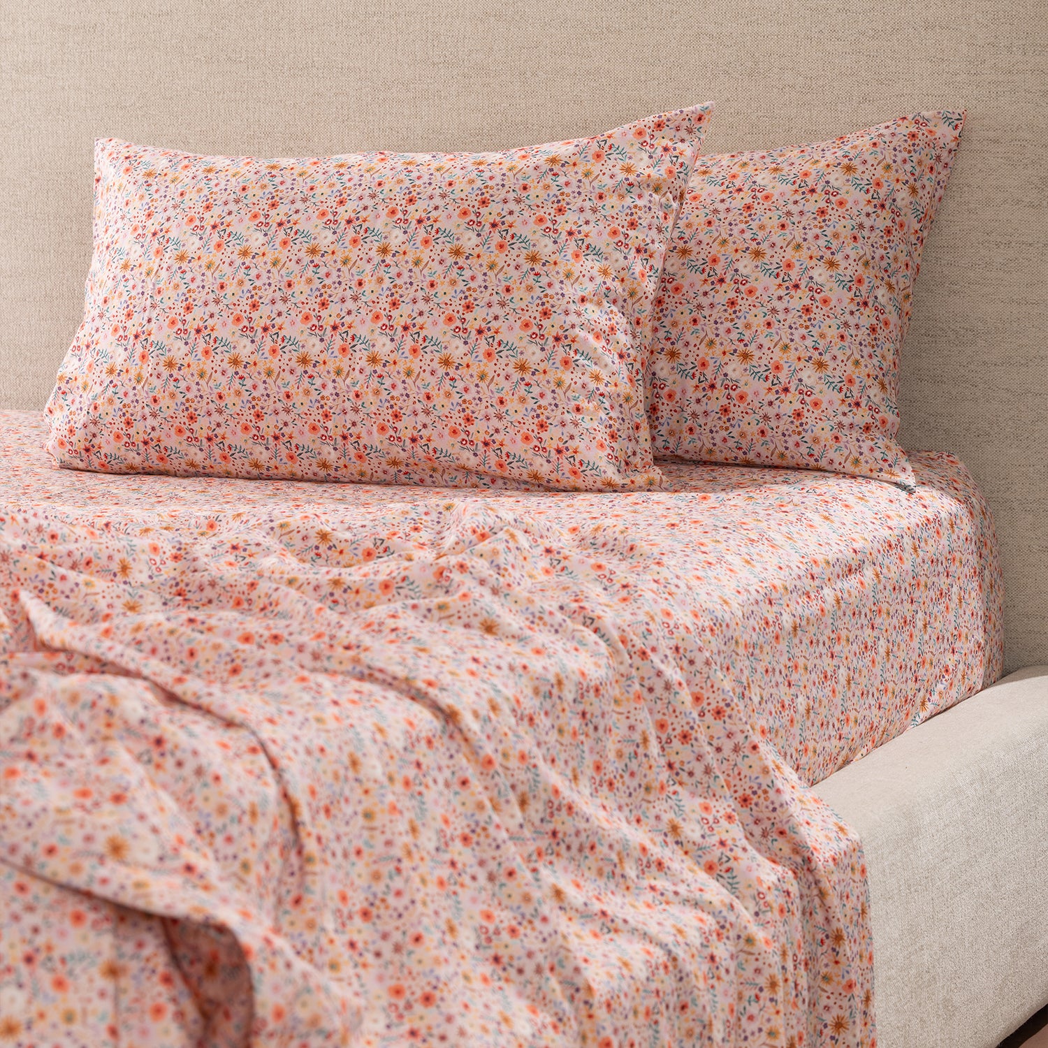 Marlo Mia Floral fitted sheet styled on a bed with matching floral pillowcases, highlighting the coordinated floral pattern.