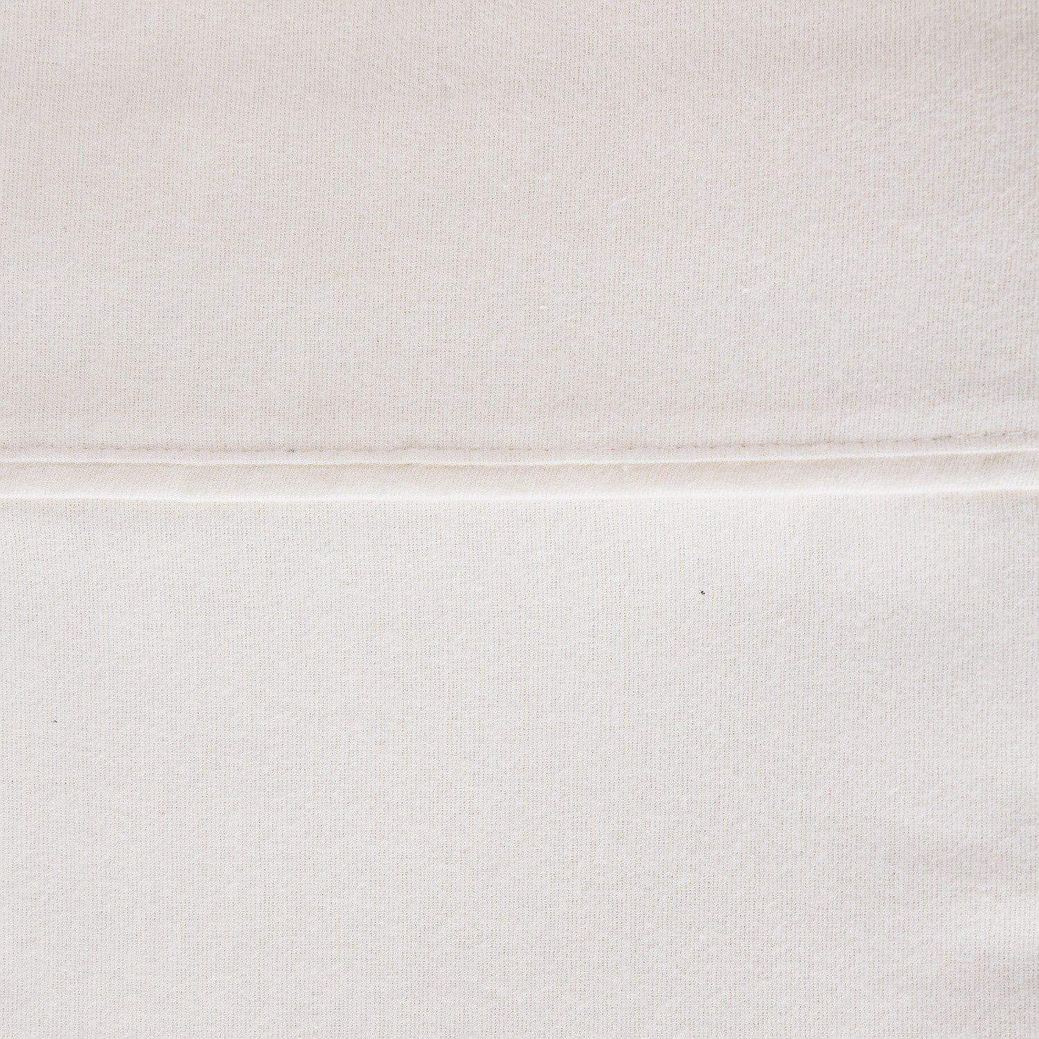 Close-up of a textured white fabric surface