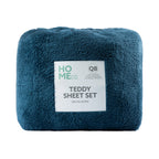 Teal teddy sheet set with a label on a white background