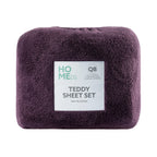 Purple teddy sheet set with a label on a white background