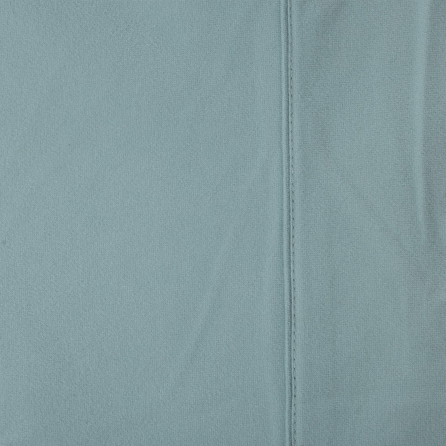 Close-up of a light blue fabric with a seam