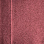 Close-up of a textured pink surface with a diagonal line.