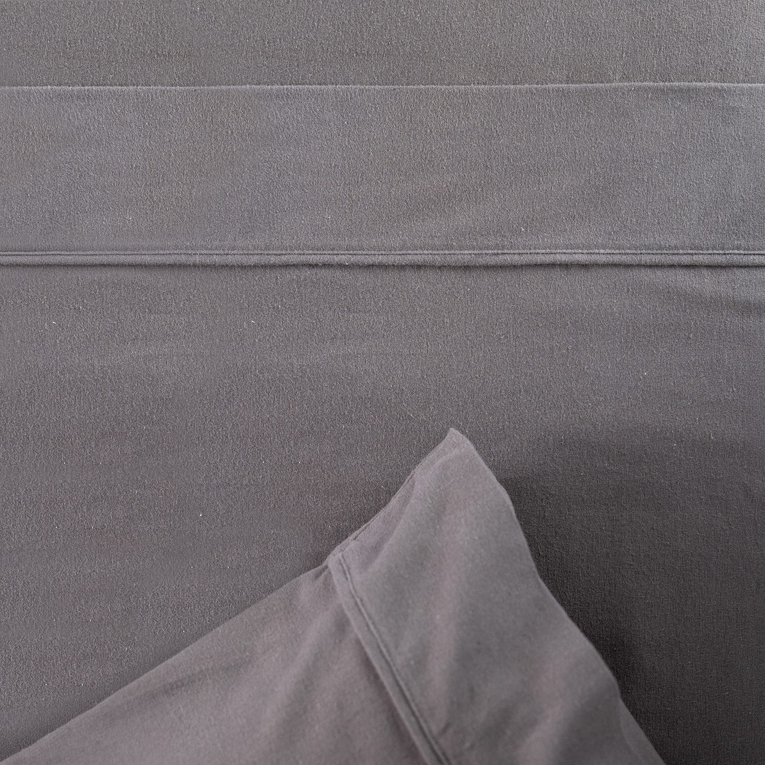Close-up of gray fabric with a subtle pattern