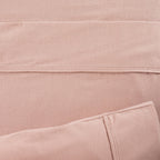 Close-up of pink fabric with a subtle texture