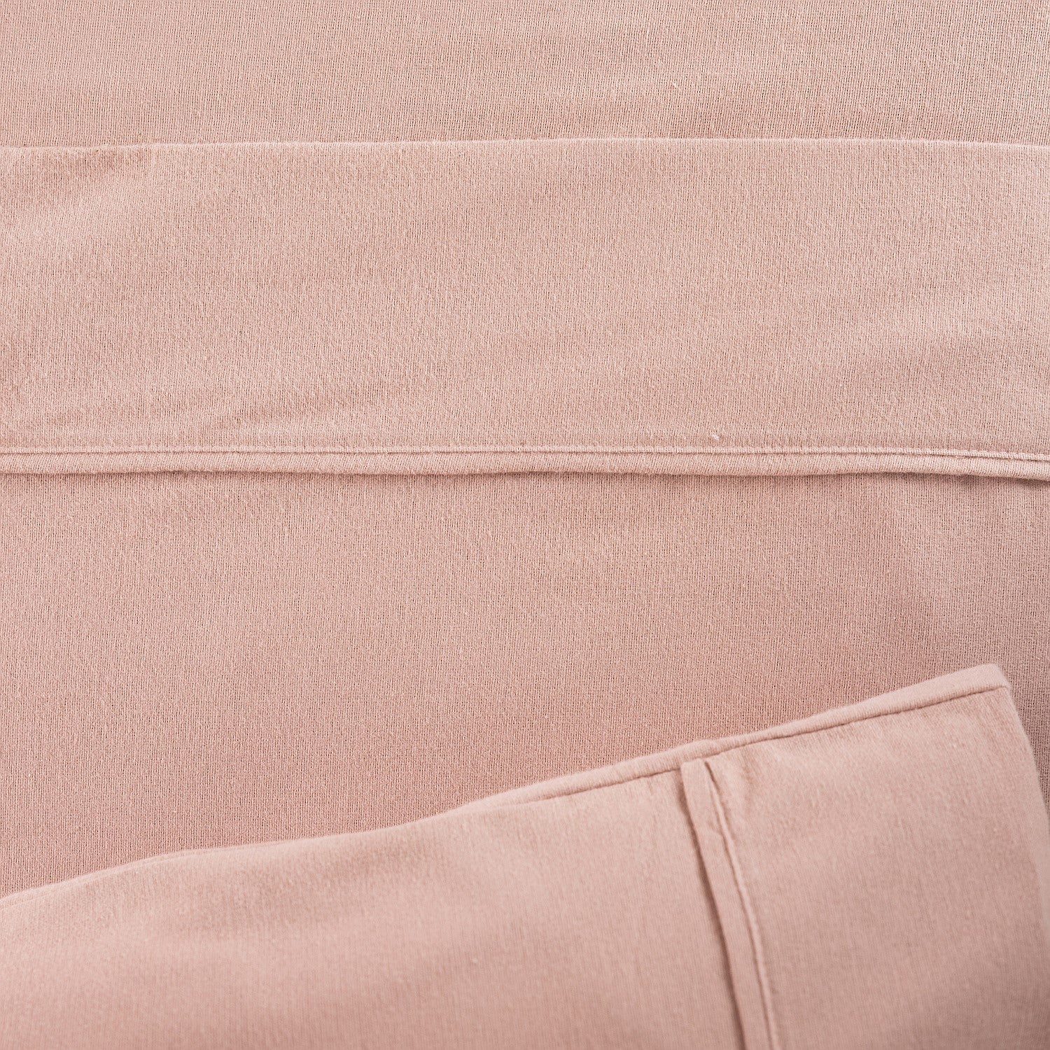 Close-up of pink fabric with a subtle texture