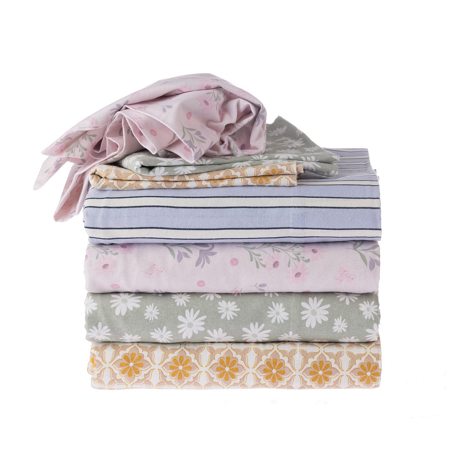 Stack of folded fabric with various patterns on a white background