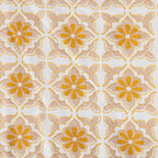 Patterned fabric with yellow flowers on a white background