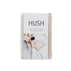 Pack of Hush pillowcases with a person holding a cup and book on a white background