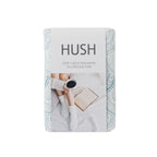 Hush pillowcases packaging with a person reading a book and drinking coffee on a white background